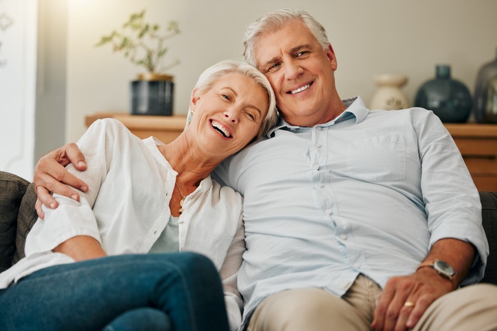 senior couple seated on the sofa