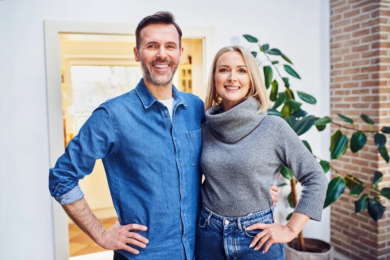 Middle aged man and woman stood side by side