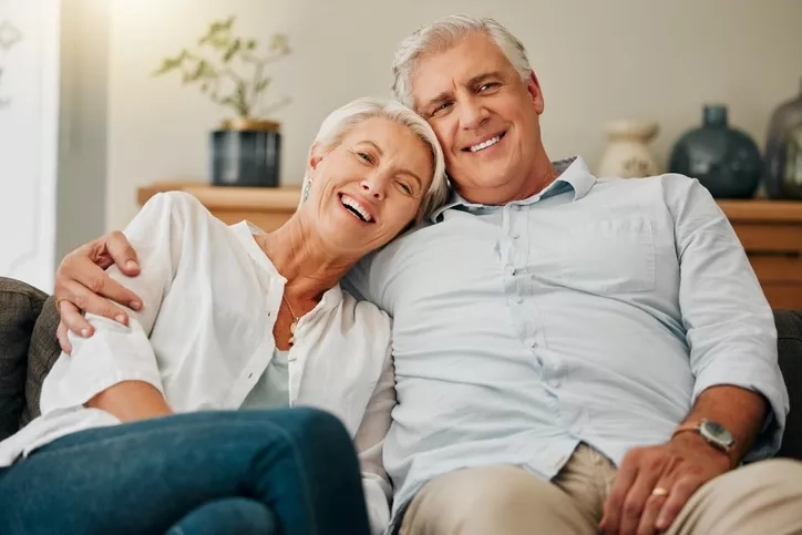 senior couple seated on the sofa