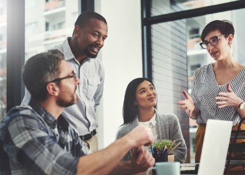 Man and woman in a meeting with two professionals