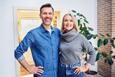 Middle aged man and woman stood side by side