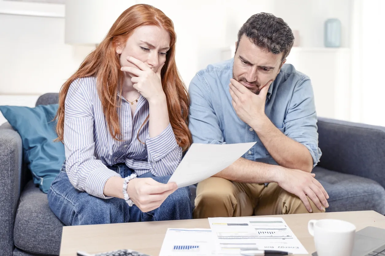 Young couple looking at expense documents