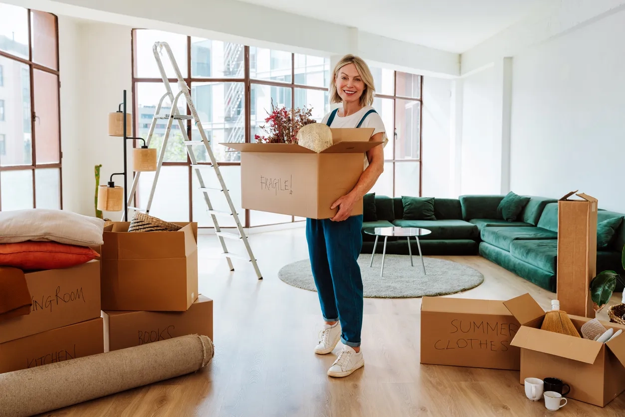 Middle aged woman moving house