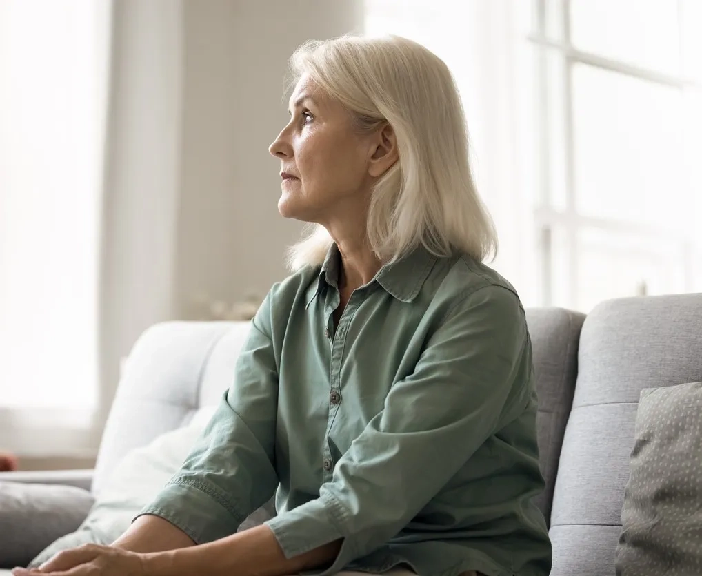 Middle aged woman thinking