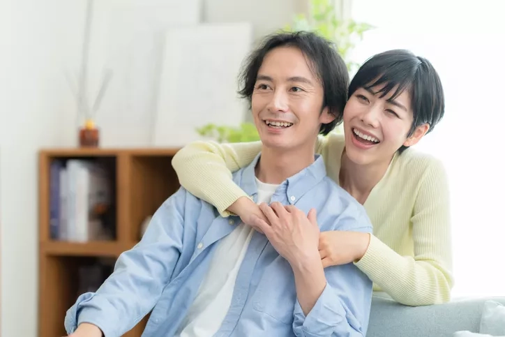Two young adults in a living room
