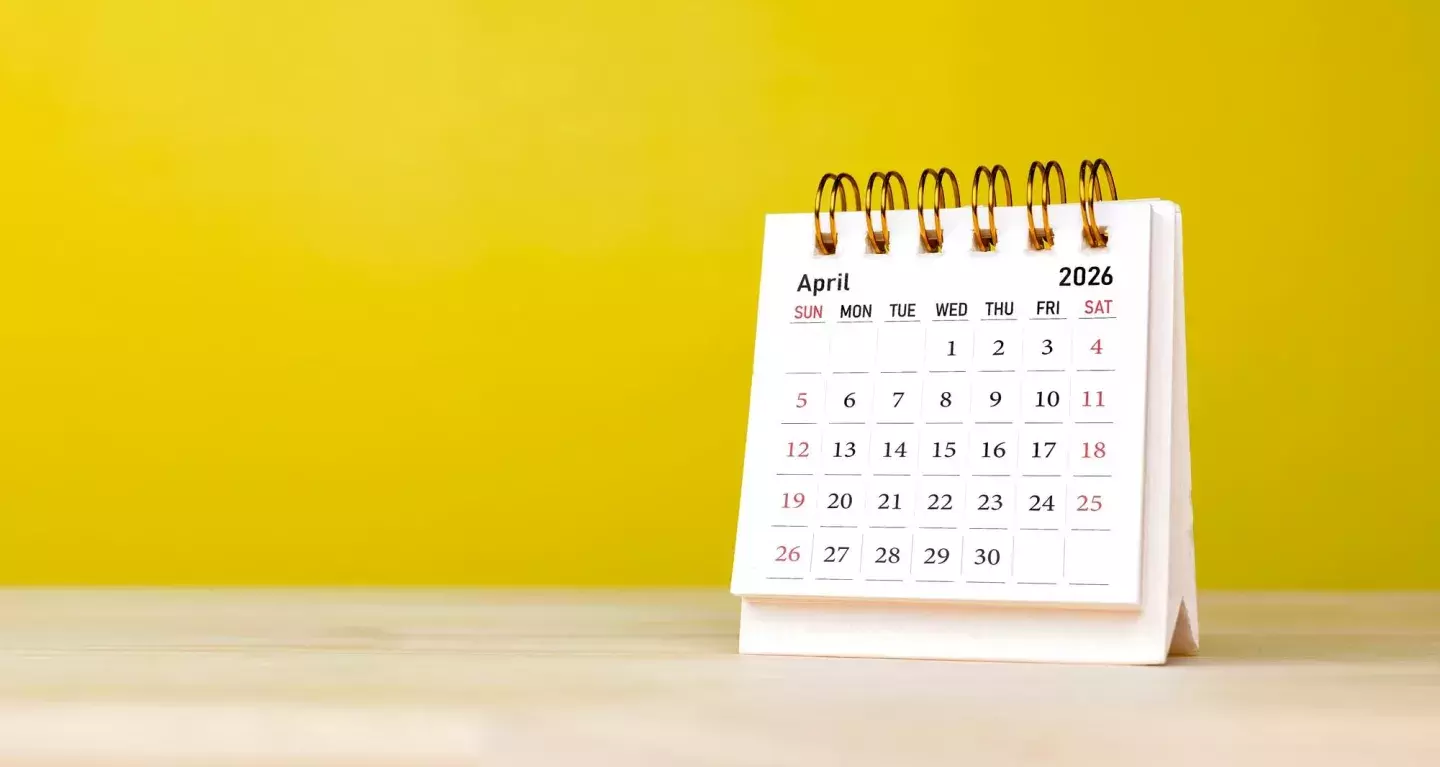A desk calendar showing April 2026
