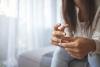 Divorced female taking off her wedding ring
