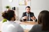 Married couple discuss financial aspects of divorce with their financial adviser 