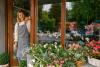 happy florist owner in a florist shop