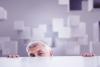 businessman peeking over desk