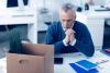 Emotionally washed out man dreaming at work