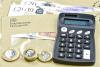 HMRC envelope, coins and calculator machine