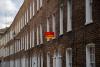 homes in London with a sign vote Labour