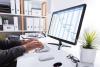 Businessperson Working on chart Using Computer