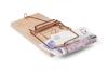 Mouse trap with 20 British pounds bill isolated over white with clipping path