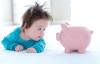 Baby boy with a piggy bank