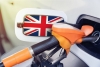 The flag of great Britain on the hatch of the gas tank of a car at a gas station