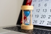 calendar, laptop and hourglass