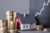 House with stacks of money and a rising curve in a graph