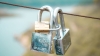 2 padlocks with another small one link them together