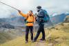 A hiker pointing the way to a fellow walker.